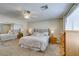 Well-lit bedroom featuring neutral colors, a plush bed, and mirrored closet at 2418 Brockton Way, Henderson, NV 89074