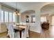 Dining room featuring hardwood floors and a stylish light fixture at 2418 Brockton Way, Henderson, NV 89074
