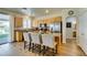 Charming kitchen with stainless appliances, granite counters, breakfast bar, and easy access to the backyard at 2418 Brockton Way, Henderson, NV 89074
