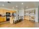 Spacious kitchen with granite counters, stainless appliances, breakfast bar seating, and hardwood flooring at 2418 Brockton Way, Henderson, NV 89074