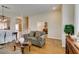 Bright living room with hardwood floors, neutral walls, and archways into the other rooms at 2418 Brockton Way, Henderson, NV 89074