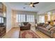 Open living room with hardwood floors and an adjacent kitchen area at 2418 Brockton Way, Henderson, NV 89074