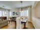 Open concept living and dining area with hardwood floors and bright windows at 2418 Brockton Way, Henderson, NV 89074