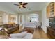 Well-lit living room features hardwood floors and an open layout with views to the kitchen and staircase at 2418 Brockton Way, Henderson, NV 89074