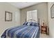 Bedroom with large window, carpeted floors and standard-sized closet at 2537 Nashira St, Henderson, NV 89044