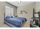 Bedroom with large window for plenty of natural light, carpeted floors, and tv at 2537 Nashira St, Henderson, NV 89044