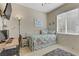 Bedroom with a cozy daybed and work desk next to a window for natural light at 2537 Nashira St, Henderson, NV 89044