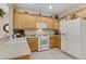 Well-lit kitchen featuring white appliances and ample counter space for food preparation at 2537 Nashira St, Henderson, NV 89044