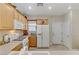 Functional kitchen featuring white appliances and plenty of cabinet space for storage at 2537 Nashira St, Henderson, NV 89044