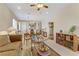 Spacious living area with dining area and chandelier, perfect for entertaining and relaxing at 2537 Nashira St, Henderson, NV 89044