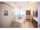Modern bathroom featuring a shower with glass door, a soaking tub, and a walk-in closet at 340 Autumn Palace Ct, Las Vegas, NV 89144
