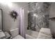 Bathroom showcasing shower/tub with tiled walls and decorative wreath at 340 Autumn Palace Ct, Las Vegas, NV 89144