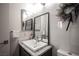 Modern bathroom featuring a single vanity with a large mirror and stylish wreath at 340 Autumn Palace Ct, Las Vegas, NV 89144