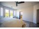 Bedroom with a ceiling fan, French doors, view of the pool and a glimpse of the bathroom at 340 Autumn Palace Ct, Las Vegas, NV 89144