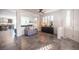 Bright living room features tile floors, plantation shutters, and seamless access to the kitchen at 340 Autumn Palace Ct, Las Vegas, NV 89144
