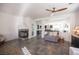 Spacious living room featuring modern tile flooring, fireplace, and an open layout, perfect for entertaining guests at 340 Autumn Palace Ct, Las Vegas, NV 89144