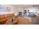 Open-concept living room boasts neutral decor, a marble fireplace, and seamless flow to other spaces at 340 Autumn Palace Ct, Las Vegas, NV 89144