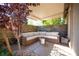 Relaxing covered patio with comfortable wicker sectional seating, offering a serene outdoor living experience at 340 Autumn Palace Ct, Las Vegas, NV 89144