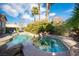 Inviting pool and spa area with lush landscaping, providing a private and relaxing outdoor retreat at 340 Autumn Palace Ct, Las Vegas, NV 89144