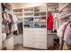 Bright walk-in closet with built-in shelving and ample storage space for clothes and accessories at 340 Autumn Palace Ct, Las Vegas, NV 89144