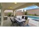 Backyard featuring a covered patio with outdoor seating and a pool at 404 Lost Horizon Ave, Henderson, NV 89002