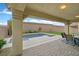 Backyard featuring a covered patio with outdoor seating and a pool at 404 Lost Horizon Ave, Henderson, NV 89002