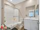 Bright bathroom featuring a shower, toilet, and vanity with a marble countertop at 404 Lost Horizon Ave, Henderson, NV 89002