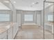 Elegant bathroom with dual sinks, a large tub, and plenty of storage space at 404 Lost Horizon Ave, Henderson, NV 89002