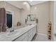 Bright bathroom with double sinks and a large mirror at 404 Lost Horizon Ave, Henderson, NV 89002