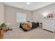 Comfortable bedroom featuring neutral walls, cozy carpeting, and ample natural light at 404 Lost Horizon Ave, Henderson, NV 89002