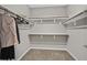 Empty walk-in closet with shelving and rods, ready for customization and storage at 404 Lost Horizon Ave, Henderson, NV 89002