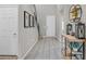 Home entryway featuring neutral-toned tile flooring, a coat closet, and decor at 404 Lost Horizon Ave, Henderson, NV 89002