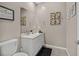 Tastefully decorated half bathroom featuring a marble vanity, modern fixtures, and stylish decor at 404 Lost Horizon Ave, Henderson, NV 89002