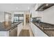 Elegant kitchen with granite countertops, stainless steel appliances, and a convenient walk-in pantry at 404 Lost Horizon Ave, Henderson, NV 89002
