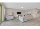 Spacious living room showcasing neutral colors, modern tile floors, and comfortable seating arrangements at 404 Lost Horizon Ave, Henderson, NV 89002