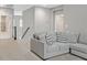 Cozy living room showcasing a comfortable gray sofa and neutral decor at 404 Lost Horizon Ave, Henderson, NV 89002
