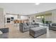 Open-concept living space seamlessly connects the living room and kitchen with access to the backyard at 404 Lost Horizon Ave, Henderson, NV 89002