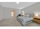 Inviting bedroom featuring a comfortable bed, bedside tables, and soft, neutral tones at 404 Lost Horizon Ave, Henderson, NV 89002