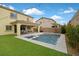 A backyard pool with a spa and patio area with a view of the two story home at 404 Lost Horizon Ave, Henderson, NV 89002