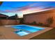 Backyard pool and spa with perimeter lighting at 404 Lost Horizon Ave, Henderson, NV 89002