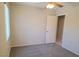 This bedroom has a large window, carpeted floors, and a ceiling fan at 4718 Victoria Garden Ave, North Las Vegas, NV 89031