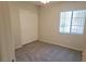 This bedroom has carpeted floors, a closet and a window at 4718 Victoria Garden Ave, North Las Vegas, NV 89031