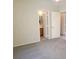 This bedroom has carpeted floors and an ensuite bathroom at 4718 Victoria Garden Ave, North Las Vegas, NV 89031