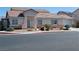 Charming single-story home featuring a well-kept front yard and attached two car garage at 4718 Victoria Garden Ave, North Las Vegas, NV 89031
