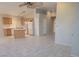 Open-concept kitchen featuring an island and white appliances overlooking the living area at 4718 Victoria Garden Ave, North Las Vegas, NV 89031