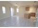 Bright living room boasts tile flooring, neutral walls, and abundant natural light at 4718 Victoria Garden Ave, North Las Vegas, NV 89031