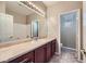 Bathroom featuring a vanity with a marble countertop, toilet room, and tub with white backsplash at 4750 Fiore Bella Blvd, Las Vegas, NV 89135