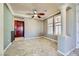 Living room featuring tile floors, neutral colors, columns, and view of the cherry wood kitchen at 4750 Fiore Bella Blvd, Las Vegas, NV 89135