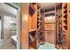 Custom walk-in closet with built-in shelving, drawers, and ample storage space at 4750 Fiore Bella Blvd, Las Vegas, NV 89135