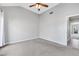 Bedroom with carpet, ceiling fan, light walls, and white trim at 5008 Shoal Creek Cir, Las Vegas, NV 89113
